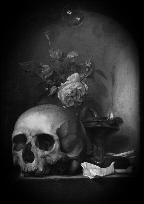 A ‘vanitas’ with a skull, mixed flowers, an oil lamp, pipes and a soap bubble in a stone