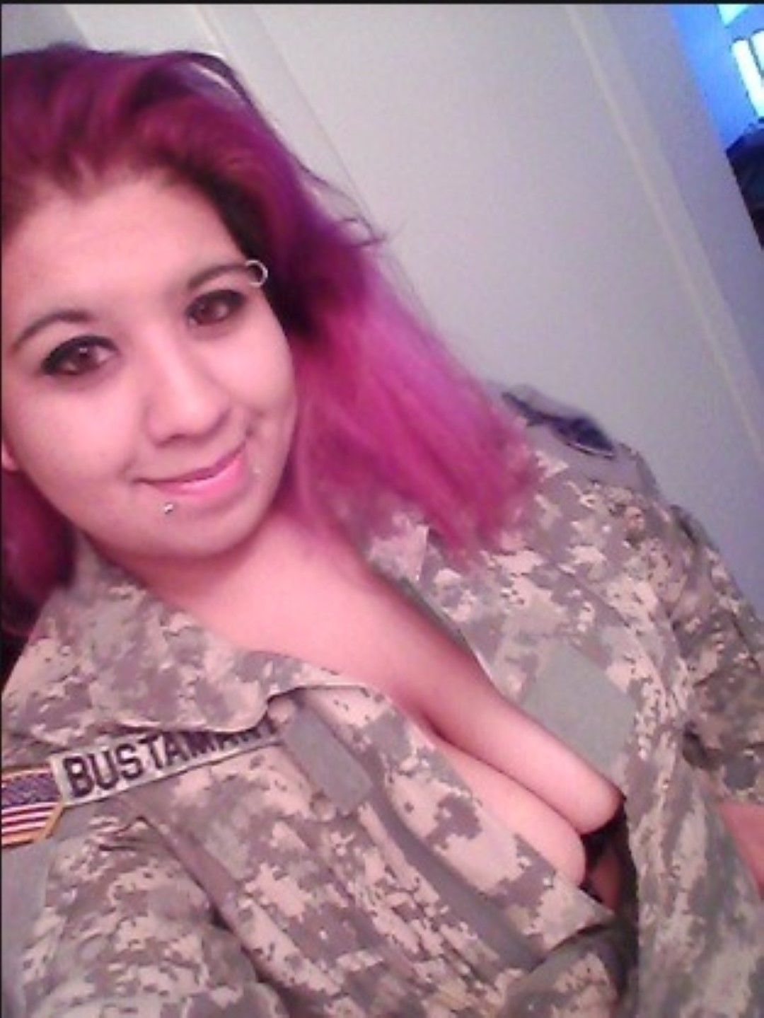 usmilitarysluts:  Army SPC Bustamante with big pierced tits lets them hang loose