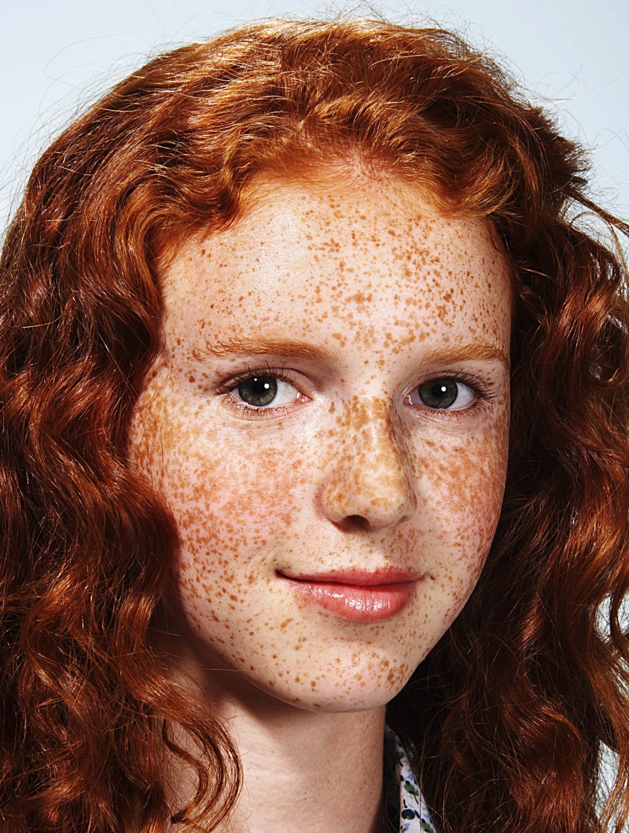 Girl with red hair freckles green eyes