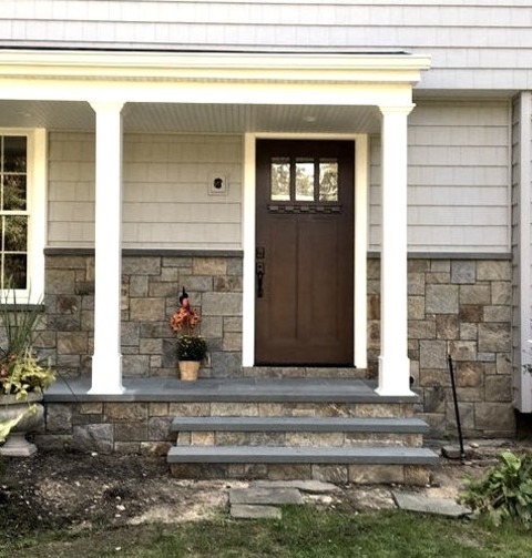 Front Yard New YorkThis Is An Illustration Of A Sizable, Contemporary Stone Front Porch With A Roof Extension.