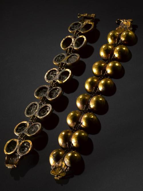 antiquitystuff:Gold bracelet made up of eight pairs of hemispherical elements.The backs are filled w