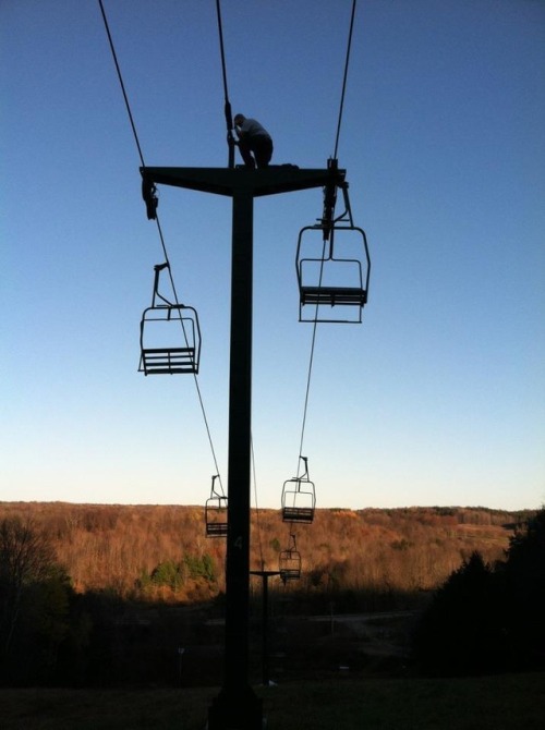 Tebowing on top of a ski chair lift