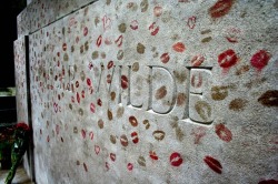gwendolencorday:  philip-ham:  ryanpanos:  Oscar Wilde’s Lipstick-Covered Tomb | Via The practice started in the late 1990s, when somebody decided to leave a lipstick kiss on the tomb. Since then lipstick kisses and hearts have been joined by a rash