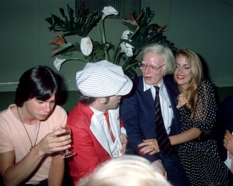 Elton John, Andy Warhol and Jerry Hall at Grace Jones’ 30th birthday party in 1978  