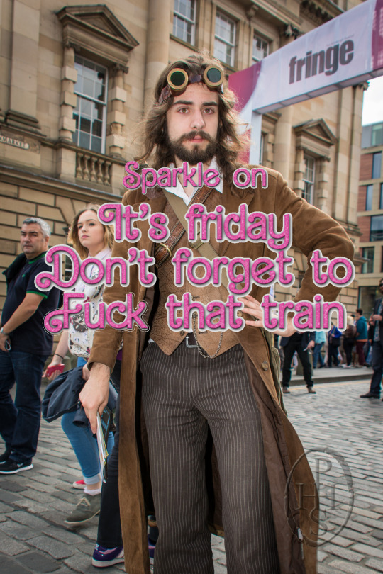 An image of Gunpowder Tim from The Mechanisms, a man with long hair, steampunk goggles, and a long leather overcoat, with the pink words 'Sparkle on, it's friday, don't forget to fuck that train' overlayed on it