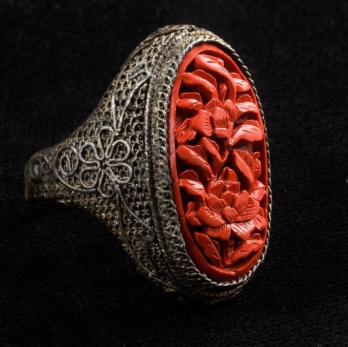 Antique deep carved cinnabar and silver metal filigree ring. China.