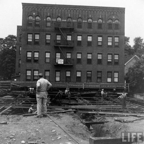 Moving an entire apartment building(Cornell Capa. 1948)