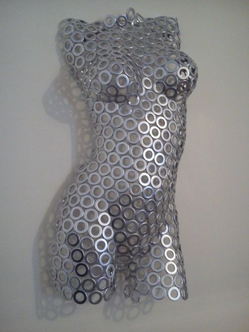 A sculpture titled ‘Washer Woman (Young Female Torso Shiny Wall statue)’ by sculptor Shaun Gagg. In a medium of steel washers. #artist#sculpture#sculptor#art#fineart#Shaun Gagg#Steel#metal#limited edition