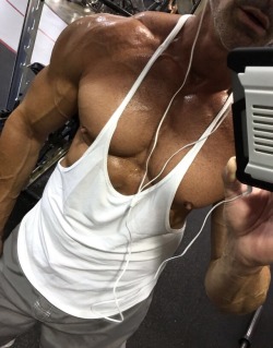 muscleroidaddict:  This is one of my favorite gym selfies. I’m such a fucking muscle slut, showing off my muscle tits in this stringer. I’m all pumped and sweaty, my nips standing at attention. I love being an exhibitionist. That’s what muscle is