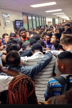 lovelyandbrown:  soulbrotherv2:  Respect. The halls of one Texas high school were filled with more than anxious students on Friday. These students literally surrounded their classmate with support after his mother lost her battle with cancer.  The photo