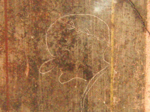 ancientart:Roman graffitiLocated in the Villa of Mysteries, Pompeii. The subject/victim of this cari
