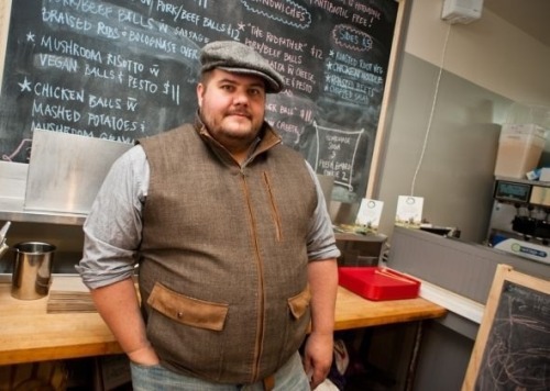 a-big-furry-rat:  That vest is super cute. Also, it says balls, like, ten times on the board behind him. 