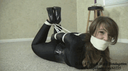 elizabethandrews:  GIF: Bitching behind a tight microfoam gag - http://clips4sale.com/63725/10824309 - Elizabeth Andrews: Catsuited Domme Double Crossed HD 