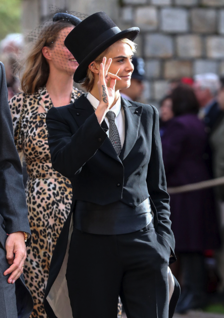 cheskamouse:  thecarolinebelle: Cause of Death: Cara Delevingne wearing tails and chewing a toothpick at the Royal Wedding.  Wedding? I thought she was off to kick someones ass. 