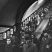 undr:John Chillingworth. Rush hour passengers on an escalator at Piccadilly Circus underground station in London. 1951