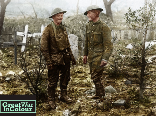 greatwarincolour:  Two soldiers share a laugh, after the troop on the left has been pulled from a mu
