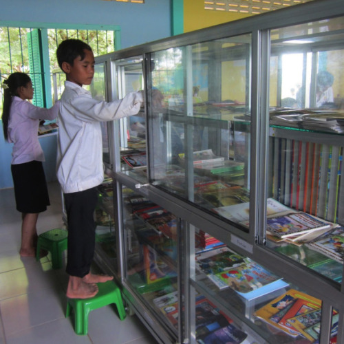 A Peace Corps Volunteer helps build a library for her community in Cambodia