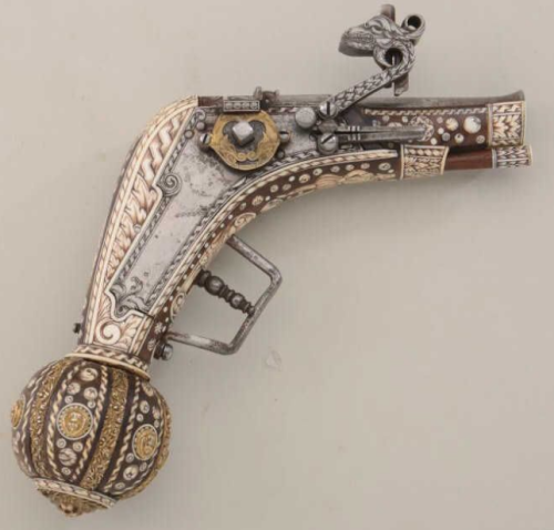 An ornate Victorian era replica of a 17th century style wheellock pistol, English, 19th century.