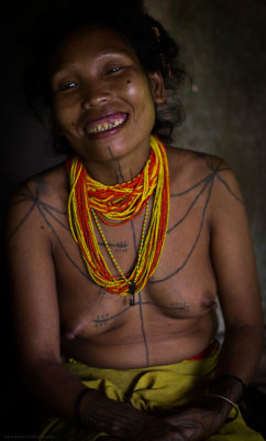 A Mentawai woman displaying traditional tattoo
