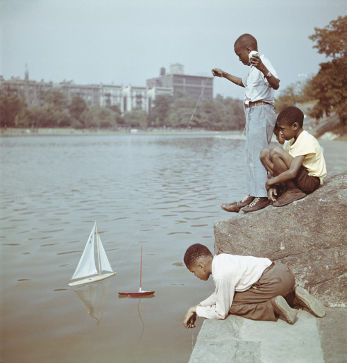 vintageeveryday:Young boys sailing model boats at Harlem Meer, Central Park, New York City, 1948. Photographed by Slim Aarons.