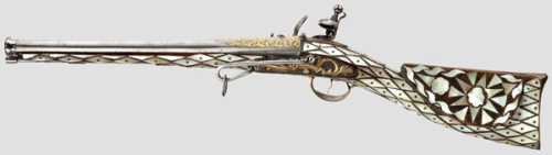 Ornate gold and mother of pearl decorated Turkish flintlock carbine, early 19th century.from Hermann