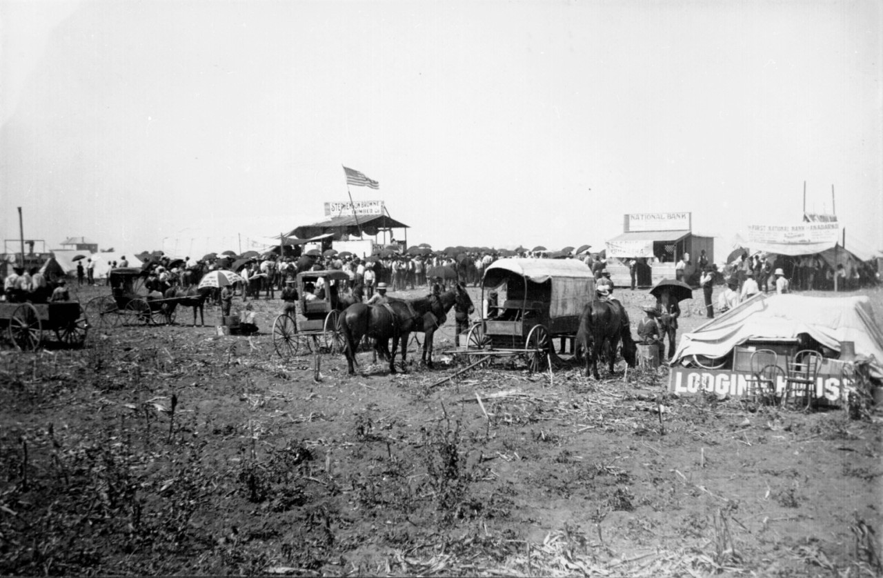historicaltimes:  “Anadarko Townsite, Auction in progress in lumber company booth.