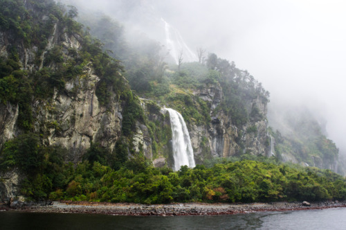 Waterfalls coming out of the clouds at Milford Sound.Milford Sound, Fiordland, South Island, New Zea