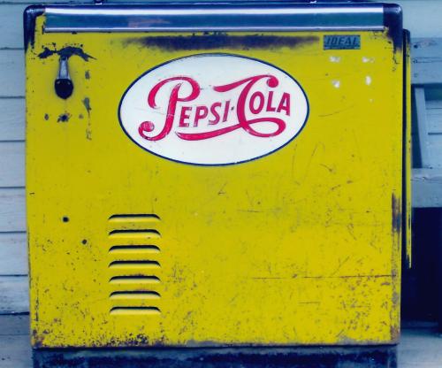 Yellow Pepsi-Cola dispenser, Barkerville, British Columbia, Canada. Barkerville is a preserved and p