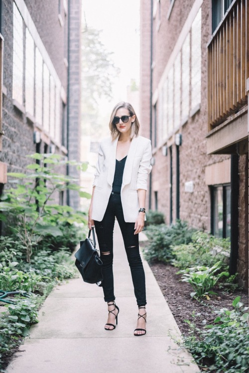 I’m iffy on ripped jeans at work, but I love the all black with a white blazer look.&mdash