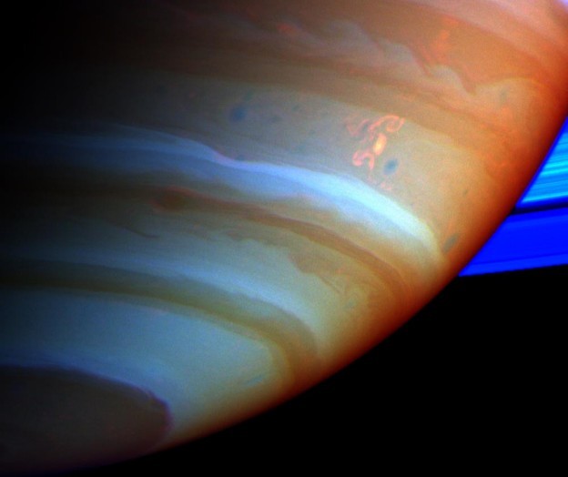 astronomyblog:  Saturn’s atmosphere exhibits a banded pattern similar to Jupiter’s,