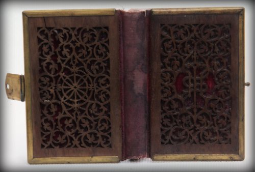 mid 19th century prayer book with unusual finely pierced wood covers and velvet beneath