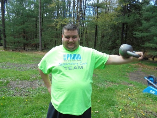 Monthly weigh in is tomorrow! Here is a pic of me looking powerful with a 30 lb kettlebell after doi
