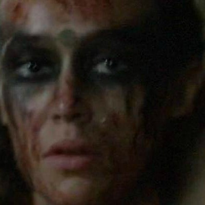 COMMANDER LEXA LETTING OUT A TEAR  BEFORE TURNING AROUND, LEAVING CLARKE ALONE