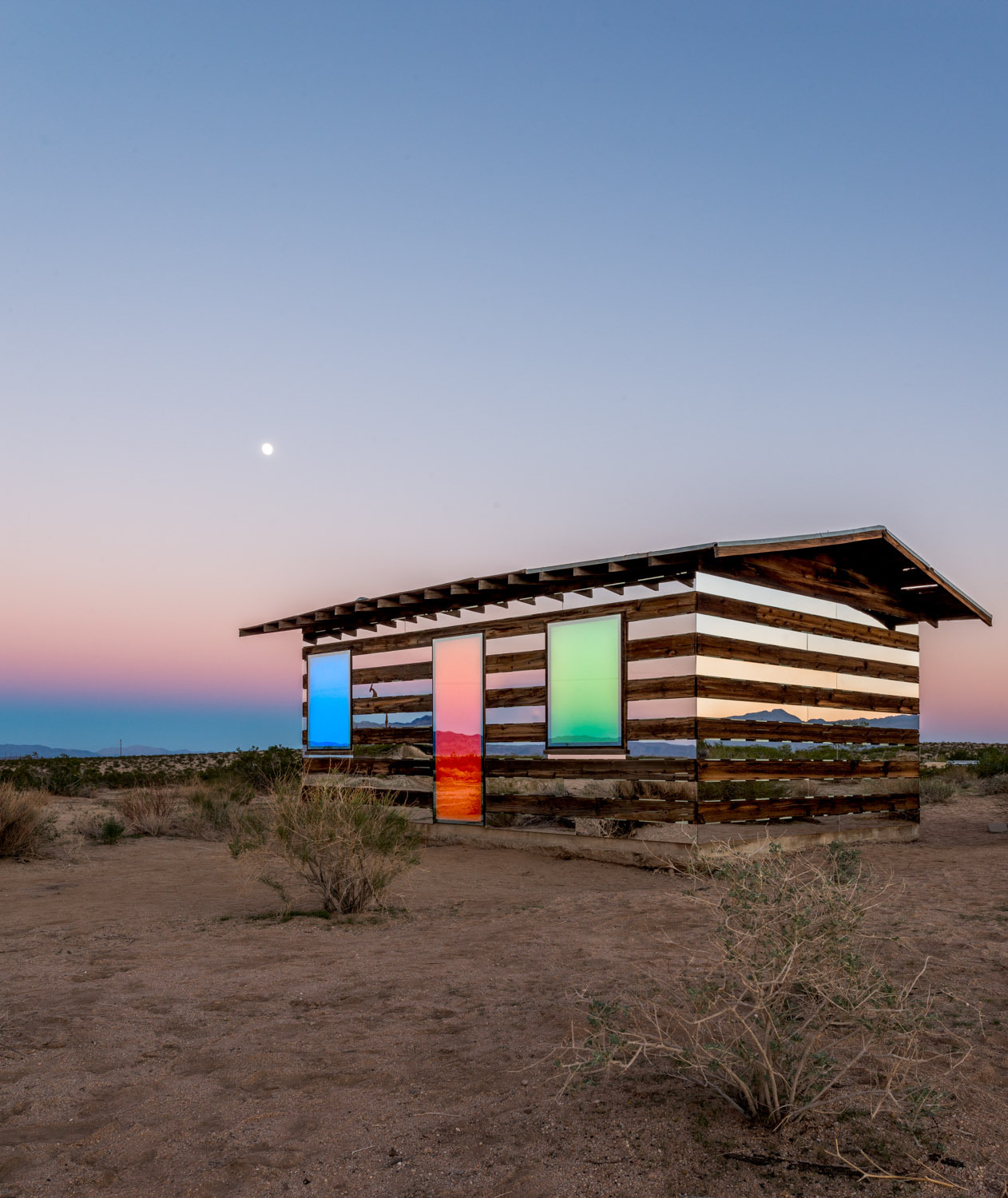 dezeen:  Lucid Stead installation by Phillip K Smith III makes a desert cabin appear