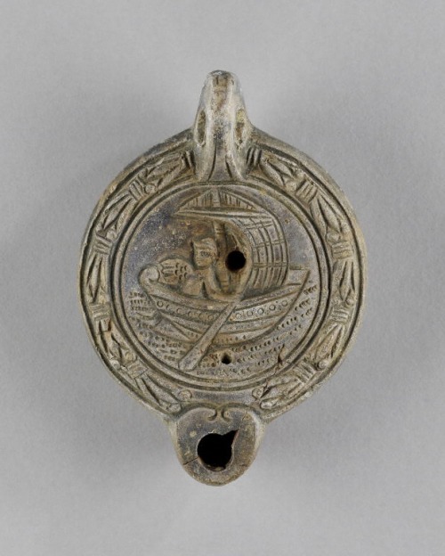 apuleiaprimilla:Terracotta mould-made lamp decorated with a fishing scene (?).The name AVGENDI inscr