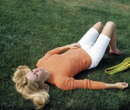 Brigitte Bardot takes a break from shooting publicity photos for Shalako (1968).