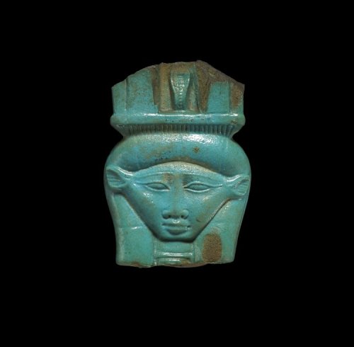 Head of Hathor; fragment of a glazed composition sistrum (musical instrument).  Nile Delta, Egy