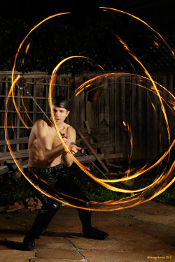 revoras:   	Meerkat by naturalturn    	Via Flickr: 	Spinning large fire poi [086066]   