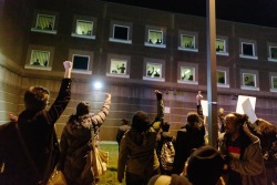 upthapermiepunx:  cryptghost:  one of the best pics I could find that wasn’t already circling around of the South Bay Correction inmates who put their hands up and shouted things through the bars of their cells in support of Michael Brown and the unrest