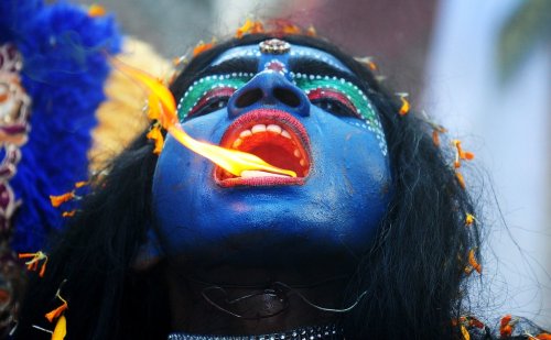 artofprayer: An Indian woman dressed as the Hindu goddess Kali appeared to breathe fire in a Ram Nav