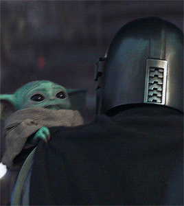 Din + Holding Baby Grogu In 2.05