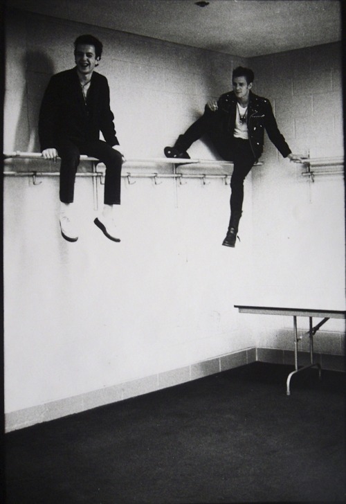 ramshacklechild:The Clash’s Joe Strummer & Paul Simonon, photographed by Pennie Smith.