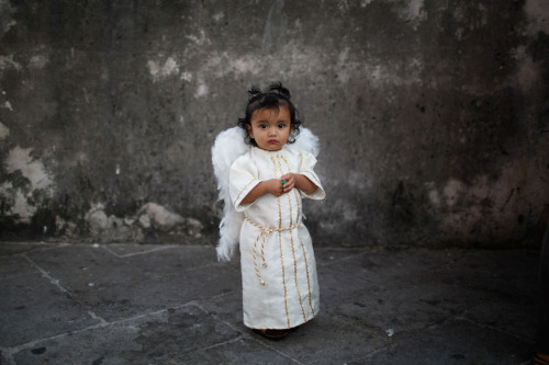 globalchristendom:  A girl dressed as an angel in Taxco, Mexico. (Photographer: Alexandre Meneghini 