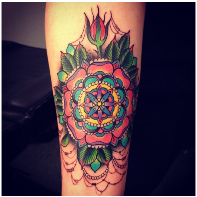 fuckyeahtattoos:  Colorful, fancy mandala done by Devin at Laguna Tattoo in Laguna