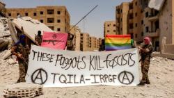 uonthaaa:  An armed militia of gay men are fighting homophobic Isis in Syria — with a banner proclaiming: “These faggots kill fascists.” The Queer Insurrection and Liberation Army (TQILA) has an AK-47 on a pink background as its logo. Members wearing