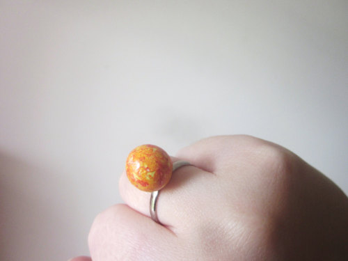 wickedclothes:  Planet Rings Bring outer space to the palm of your hand. Or to your fingers. Each of these rings resemble a piece of space. Featuring Neptune, Earth, the Sun, and a deep blue-colored galaxy, each of these rings are adjustable to fit your