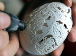 Sculptures carved from egg shells by Chinese