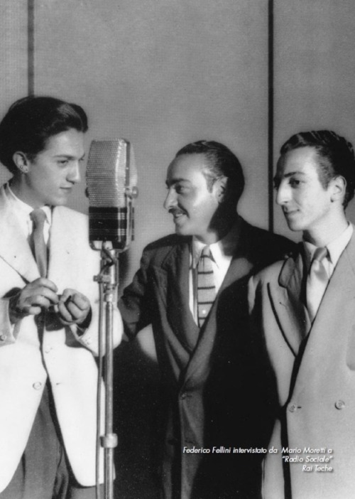 A very young Fellini on the left interviewed on the radio.