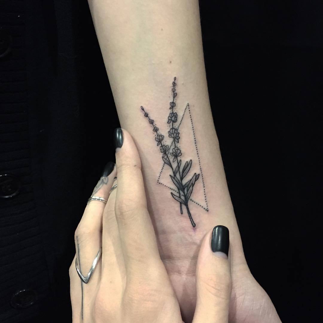 Fine line style lavender tattoo on the left forearm