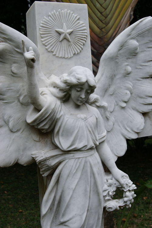 Angel statue on the gravestone of Michael Sarkies Martin, Armenian Church, Singapore.